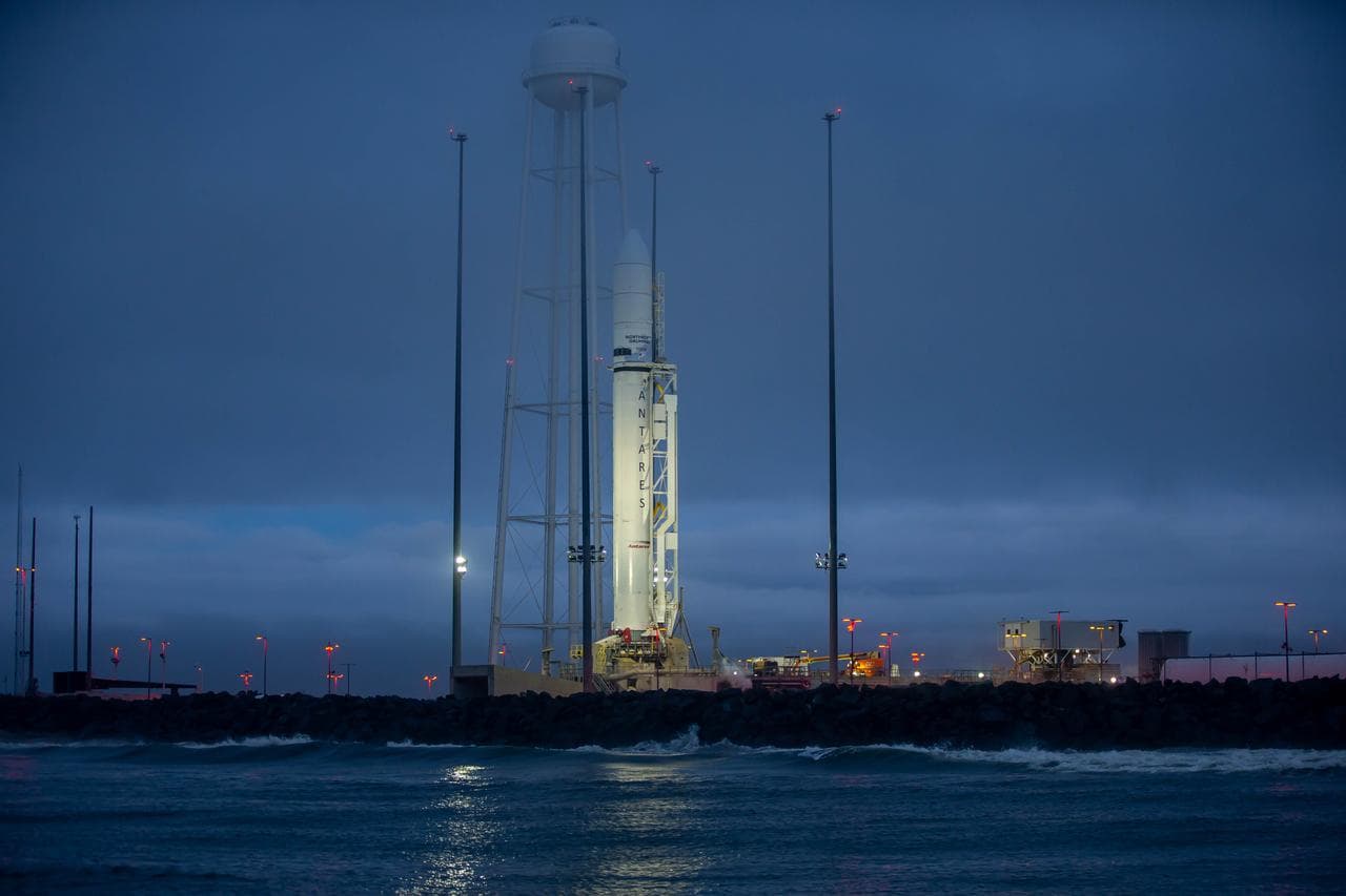 Antares rocket illuminated on the Wallops launch pad at blue hour